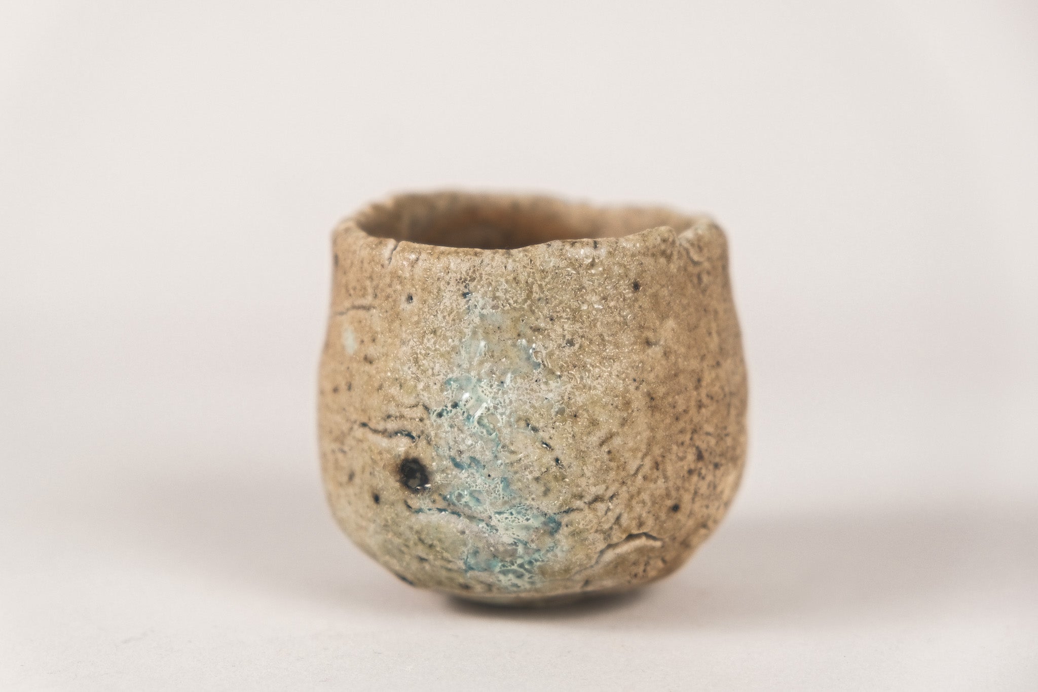 Teacup - Unglazed Wood-fired · Teacup with Sky Blue Crackle Grass and Wood Ash Glaze